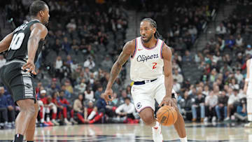 Jan 29, 2025; San Antonio, Texas, USA;  LA Clippers forward Kawhi Leonard (2) dribbles in front of San Antonio Spurs forward Harrison Barnes (40) in the first half at Frost Bank Center. Mandatory Credit: Daniel Dunn-Imagn Images