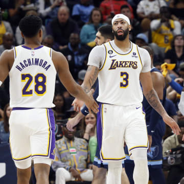 Apr 16, 2023; Memphis, Tennessee, USA; Los Angeles Lakers forward Anthony Davis (3) reacts with forward Rui Hachimura (28) and guard Austin Reaves (15) during the second half during game one of the 2023 NBA playoffs against the Memphis Grizzlies at FedExForum. Mandatory Credit: Petre Thomas-USA TODAY Sports