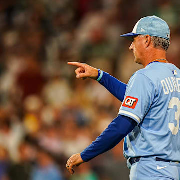Aug 5, 2025; Boston, Massachusetts, USA; Kansas City Royals manager Matt Quatraro (33) calls for a relief pitcher against the Boston Red Sox in the seventh inning at Fenway Park. Mandatory Credit: David Butler II-Imagn Images