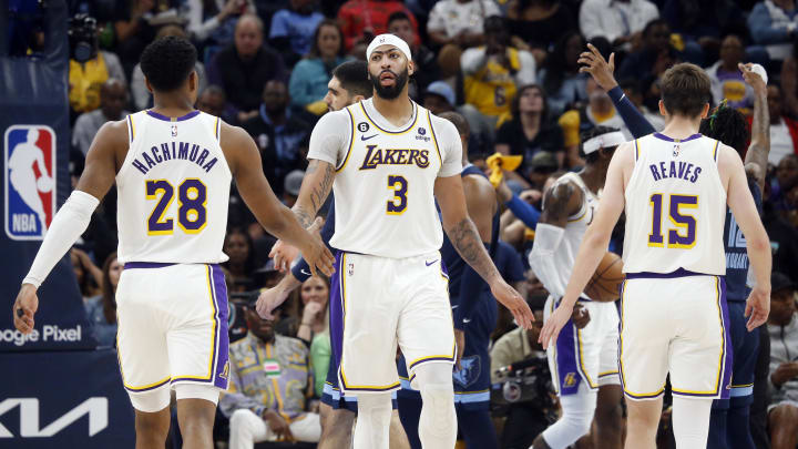 Apr 16, 2023; Memphis, Tennessee, USA; Los Angeles Lakers center Anthony Davis (3) reacts with forward Rui Hachimura (28) and guard Austin Reaves (15).