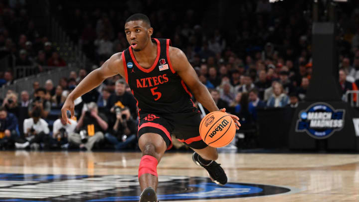 Mar 28, 2024; Boston, MA, USA; San Diego State Aztecs guard Lamont Butler (5) dribbles the ball against the Connecticut Huskies in the semifinals of the East Regional of the 2024 NCAA Tournament at TD Garden. Mandatory Credit: Brian Fluharty-USA TODAY Sports