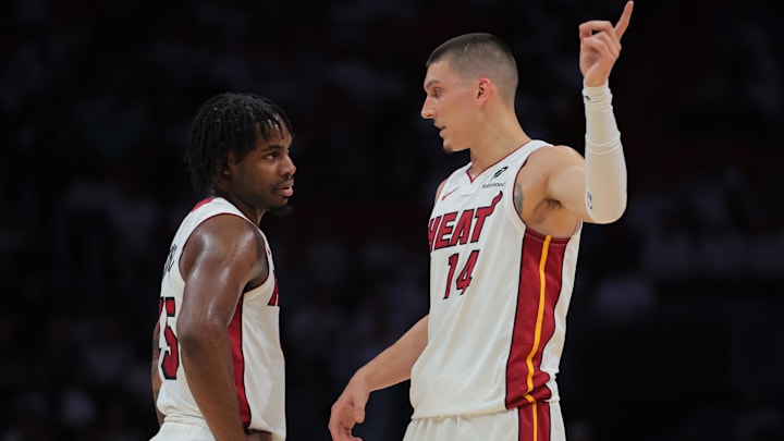 Apr 26, 2025; Miami, Florida, USA; Miami Heat guard Davion Mitchell (45) and Miami Heat guard Tyler Herro (14) talk against the Cleveland Cavaliers in the first quarter during game three for the first round of the 2025 NBA Playoffs at Kaseya Center. Mandatory Credit: Sam Navarro-Imagn Images Apr 26, 2025; Miami, Florida, USA; Miami Heat guard Davion Mitchell (45) and Miami Heat guard Tyler Herro (14) talk against the Cleveland Cavaliers in the first quarter during game three for the first round of the 2025 NBA Playoffs at Kaseya Center. Mandatory Credit: Sam Navarro-Imagn Images