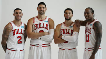 Sep 27, 2021; Chicago, Illinois, USA; Chicago Bulls guard Lonzo Ball (2) center Nikola Vucevic (9) guard Zach LaVine (8) and  forward DeMar DeRozan (11) pose for photos during Chicago Bulls Media Day at the United Center. Mandatory Credit: David Banks-Imagn Images
