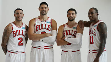 Sep 27, 2021; Chicago, Illinois, USA; Chicago Bulls guard Lonzo Ball (2) center Nikola Vucevic (9) guard Zach LaVine (8) and  forward DeMar DeRozan (11) pose for photos during Chicago Bulls Media Day at the United Center. Mandatory Credit: David Banks-Imagn Images