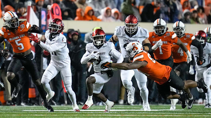 Cincinnati Bearcats wide receiver Aaron Turner (9) runs for a first down in the second quarter of the NCAA Big12 football game between the Oklahoma State Cowboys and the Cincinnati Bearcats at Boone Pickens Stadium in Stillwater, Okla., on Saturday, Oct. 28, 2023.