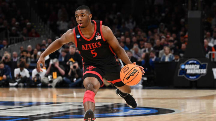 Mar 28, 2024; Boston, MA, USA; San Diego State Aztecs guard Lamont Butler (5) dribbles the ball against the Connecticut Huskies in the semifinals of the East Regional of the 2024 NCAA Tournament at TD Garden. Mandatory Credit: Brian Fluharty-USA TODAY Sports