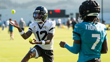 Jacksonville Jaguars wide receivers Travis Hunter and Brian Thomas Jr. use tennis balls in a NFL training camp session