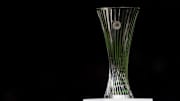 The trophy of the UEFA Conference League is seen on a plinth...