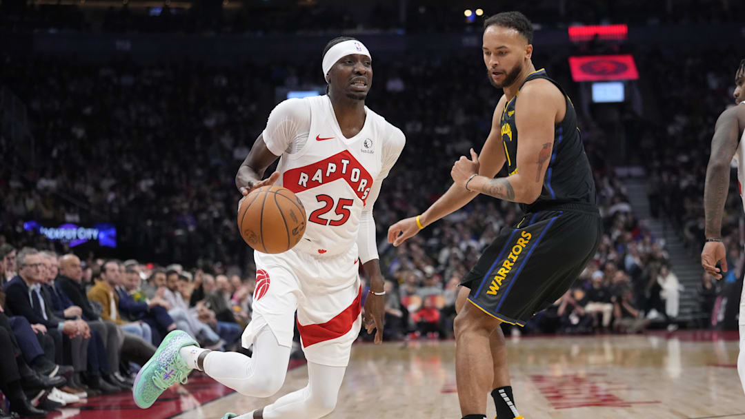 Jan 13, 2025; Toronto, Ontario, CAN; Toronto Raptors forward Chris Boucher (25) dribbles around Golden State Warriors forward Kyle Anderson (1) during the first half at Scotiabank Arena. Mandatory Credit: John E. Sokolowski-Imagn Images