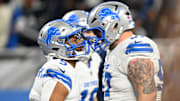 Lions running back David Montgomery celebrates with center Trystan Colon after a 35-yard touchdown run in Detroit's win over Dallas on Thursday night.
