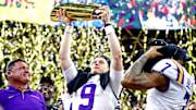 Jan 13, 2020; New Orleans, Louisiana, USA; LSU Tigers head coach Ed Orgeron and LSU Tigers quarterback Joe Burrow (9) celebrate with the National Championship trophy after beating Clemson Tigers in the College Football Playoff national championship game at Mercedes-Benz Superdome. Mandatory Credit: Matthew Emmons-Imagn Images