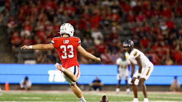 Sep 7, 2024; Tucson, Arizona, USA; Arizona Wildcats Tyler Loop (33) goes to kick the bal during kickoff against Northern Arizona Lumberjacks during first quarter at Arizona Stadium. Mandatory Credit: Aryanna Frank-Imagn Images