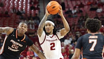 Nov 18, 2024; Fayetteville, Arkansas, USA; Arkansas Razorbacks guard Boogie Fland (2) drives against Pacific Tigers guard Elijah Fisher (22) during the second half at Bud Walton Arena. Arkansas won 91-72. Mandatory Credit: Nelson Chenault-Imagn Images
