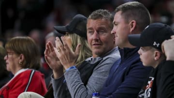 Feb 13, 2024; Cincinnati, Ohio, USA; ESPN commentator Kirk Herbstreit talks with Cincinnati Bengals head coach Zac Taylor during the first half in the game between the Iowa State Cyclones and the Cincinnati Bearcats at Fifth Third Arena. Mandatory Credit: Katie Stratman-USA TODAY Sports