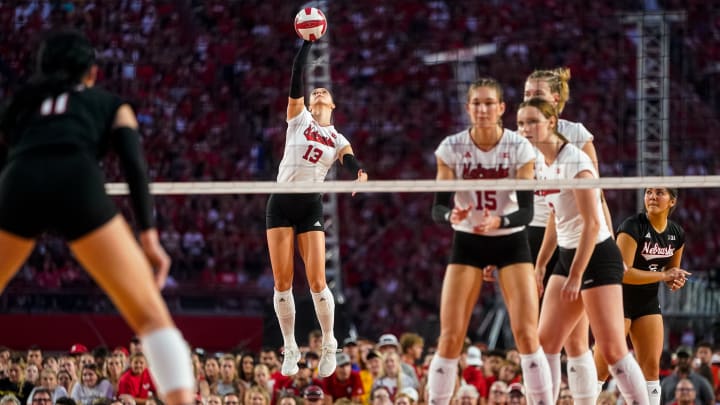 Aug 30, 2023; Lincoln, NE, USA; Nebraska Cornhuskers outside hitter Merritt Beason (13) serves against the Omaha Mavericks during the second set at Memorial Stadium. 