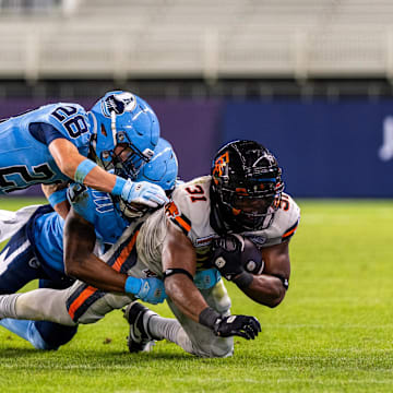 Jun 9, 2024; Toronto, Ontario, CAN; Toronto Argonauts defensive back Mason Pierce (28) tackles BC Lions running back William Stanback (31) at BMO Field. Mandatory Credit: Kevin Sousa-Imagn Images