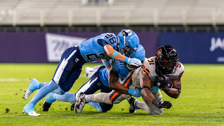 Jun 9, 2024; Toronto, Ontario, CAN; Toronto Argonauts defensive back Mason Pierce (28) tackles BC Lions running back William Stanback (31) at BMO Field. Mandatory Credit: Kevin Sousa-Imagn Images