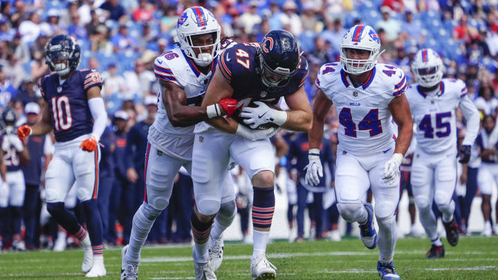 Bears linebacker Micah Baskerville has the ball and looks to escape against Buffalo in a 33-7 Bears preseason win.