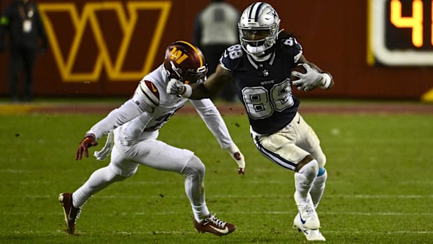 Dallas Cowboys wide receiver CeeDee Lamb (88) gains extra yards after a catch against Washington 