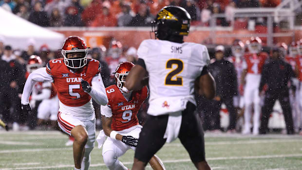 Utah Utes Safety Tao Johnson and Arizona State Sun Devils Quarterback Jeff Sims 