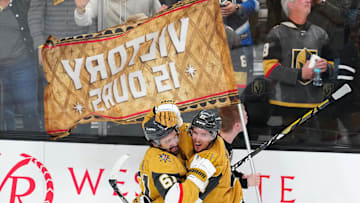 Apr 29, 2025; Las Vegas, Nevada, USA; Vegas Golden Knights center Brett Howden (21) celebrates with Vegas Golden Knights right wing Mark Stone (61) after scoring a goal against the Minnesota Wild in an overtime period to give the Golden Knights a 3-2 victory in game five of the first round of the 2025 Stanley Cup Playoffs at T-Mobile Arena. Mandatory Credit: Stephen R. Sylvanie-Imagn Images