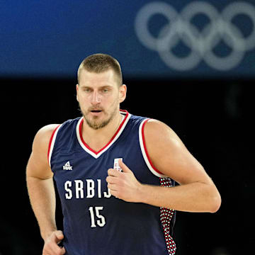 Aug 10, 2024; Paris, France; Serbia power forward Nikola Jokic (15) runs up the court against Germany in the men's basketball bronze medal game during the Paris 2024 Olympic Summer Games at Accor Arena. Mandatory Credit: Kyle Terada-Imagn Images