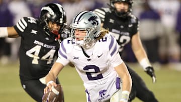Nov 30, 2024; Ames, Iowa, USA;  Kansas State Wildcats quarterback Avery Johnson (2) is pressured by Iowa State Cyclones linebacker Jacob Ellis (44)  in the fourth quarter at Jack Trice Stadium. Mandatory Credit: Reese Strickland-Imagn Images