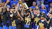 Jun 22, 2025; Oklahoma City, Oklahoma, USA; Oklahoma City Thunder forward Kenrich Williams (34) holds up the NBA Finals Larry O'Brien Championship Trophy after his team defeated the Indiana Pacers in game seven of the 2025 NBA Finals at Paycom Center. Mandatory Credit: Alonzo Adams-Imagn Images