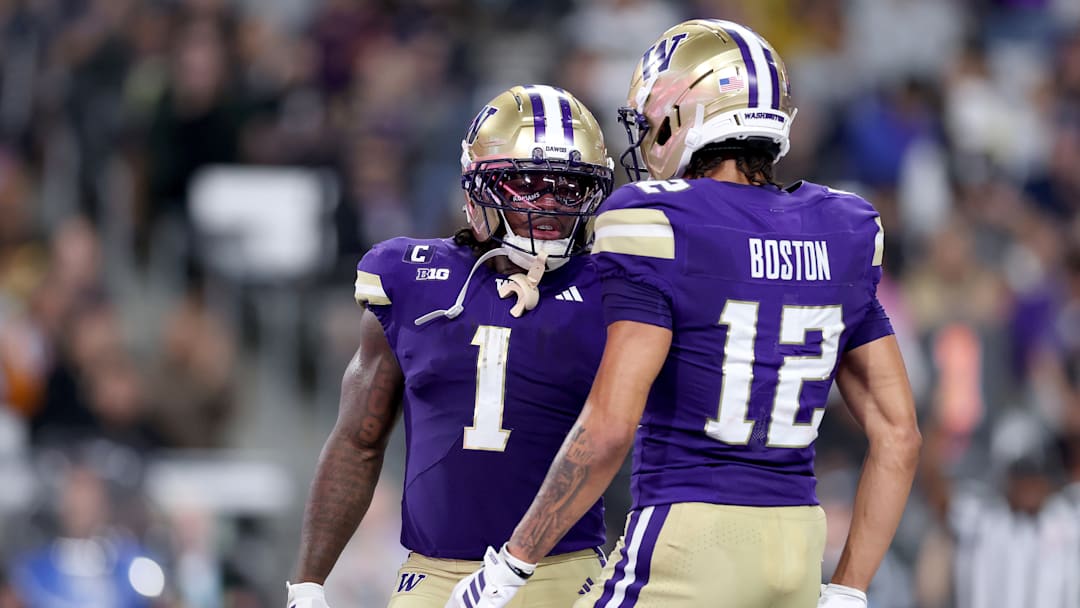 University of Washington running back Jonah Coleman (1) and receiver Denzel Boston (12) speak during the Huskies' Week 2 win over UC Davis.
