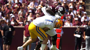 Sep 7, 2024; College Station, Texas, USA; Texas A&M Aggies offensive lineman Ar'maj Reed-Adams (55) blocks McNeese State linebacker Tristan Driggers during the first quarter at Kyle Field. Mandatory Credit: Dustin Safranek-Imagn Images