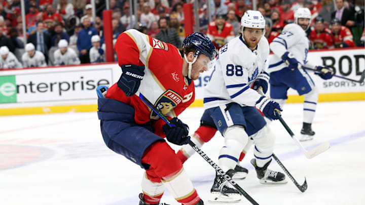 May 11, 2025; Sunrise, Florida, USA; Florida Panthers left wing Matthew Tkachuk (19) and Toronto Maple Leafs right wing William Nylander (88) skate to control the puck during the third period in game four of the second round of the 2025 Stanley Cup Playoffs at Amerant Bank Arena. Mandatory Credit: Kim Klement Neitzel-Imagn Images