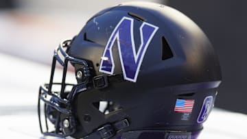 Nov 11, 2023; Madison, Wisconsin, USA;  General view of a Northwestern Wildcats helmet on the sidelines during the game against the Wisconsin Badgers at Camp Randall Stadium. Mandatory Credit: Jeff Hanisch-Imagn Images