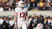 Nov 23, 2024; Berkeley, California, USA; Stanford Cardinal place kicker Emmet Kenney (13) prepares to kick a field goal against the California Golden Bears during the second quarter at California Memorial Stadium. Mandatory Credit: Darren Yamashita-Imagn Images