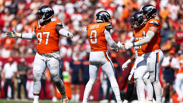 Sep 22, 2024; Tampa, Florida, USA; Denver Broncos linebacker Jonathon Cooper (0) celebrates after a sack against the Tampa Bay Buccaneers in the fourth quarter at Raymond James Stadium. Mandatory Credit: Nathan Ray Seebeck-Imagn Images