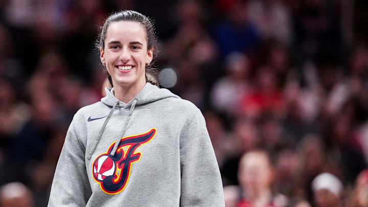 Indiana Fever guard Caitlin Clark (22) smiles Saturday, May 3, 2025, during a timeout at a preseason game between the Indiana Fever and the Washington Mystics.