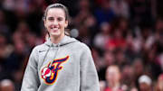 Indiana Fever Caitlin Clark smiles during a timeout at a preseason game against the Washington Mystics.