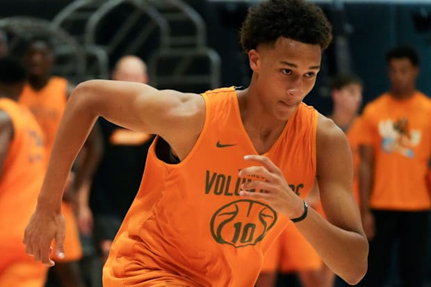 Tennessee forward Nate Ament sprints downcourt during drills at basketball practice.