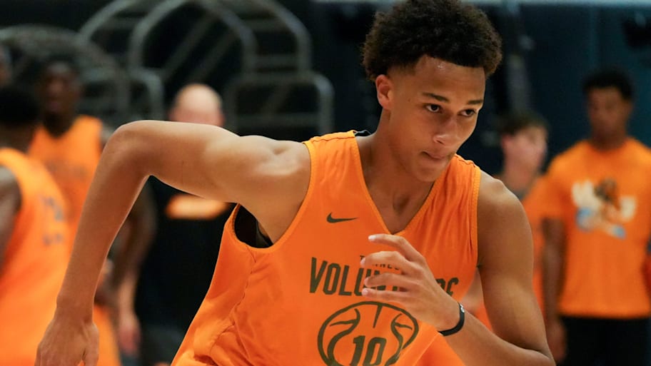 Tennessee forward Nate Ament sprints downcourt during drills at basketball practice.