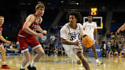 Nov 3, 2025; Los Angeles, California, USA;  UCLA Bruins guard Skyy Clark (55) drives to the basket against Eastern Washington Eagles forward Emmett Marquardt (33) during the second half at Pauley Pavilion presented by Wescom Financial. Mandatory Credit: Kiyoshi Mio-Imagn Images