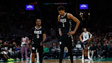 Spurs' Chris Paul (left) and Victor Wembanyama (right) pictured versus Boston Celtics