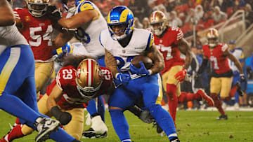 Dec 12, 2024; Santa Clara, California, USA; Los Angeles Rams running back Blake Corum (22) carries the ball against San Francisco 49ers safety Talanoa Hufanga (29) during the first quarter at Levi's Stadium. Mandatory Credit: Kelley L Cox-Imagn Images