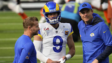 Feb 13, 2022; Inglewood, CA, USA;  Los Angeles Rams head coach Sean McVay talks with quarterback Matthew Stafford (9) before playing against the Cincinnati Bengals in Super Bowl LVI at SoFi Stadium. Mandatory Credit: Robert Hanashiro-Imagn Images