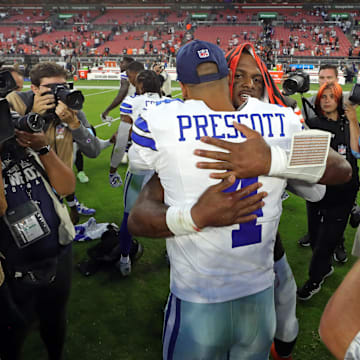 Cleveland Browns quarterback Deshaun Watson (4) hugs Dallas Cowboys quarterback Dak Prescott (4) after an NFL football game at Huntington Bank Field, Sunday, Sept. 8, 2024, in Cleveland, Ohio.