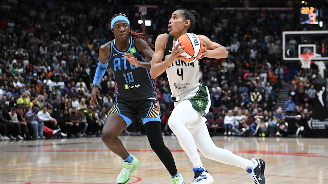 Aug 15, 2025; Vancouver, British Columbia, CAN;  Seattle Storm guard Skylar Diggins (4) drives down court against Atlanta Dream guard Rhyne Howard (10) during the second half at Rogers Arena. Mandatory Credit: Anne-Marie Sorvin-Imagn Images 
