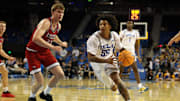 Nov 3, 2025; Los Angeles, California, USA;  UCLA Bruins guard Skyy Clark (55) drives to the basket against Eastern Washington Eagles forward Emmett Marquardt (33) during the second half at Pauley Pavilion presented by Wescom Financial. Mandatory Credit: Kiyoshi Mio-Imagn Images