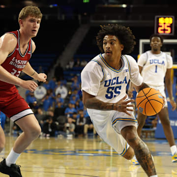 Nov 3, 2025; Los Angeles, California, USA;  UCLA Bruins guard Skyy Clark (55) drives to the basket against Eastern Washington Eagles forward Emmett Marquardt (33) during the second half at Pauley Pavilion presented by Wescom Financial. Mandatory Credit: Kiyoshi Mio-Imagn Images