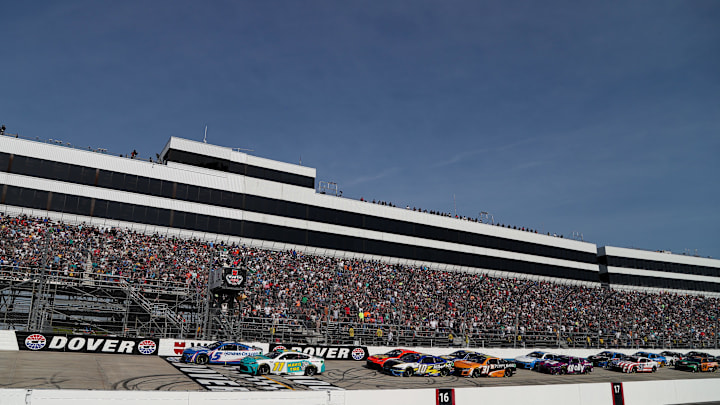 Apr 28, 2024; Dover, Delaware, USA; NASCAR Cup Series driver Kyle Larson (5) leads the field on a restart during the Wurth 400 at Dover Motor Speedway. Mandatory Credit: Matthew O'Haren-Imagn Images