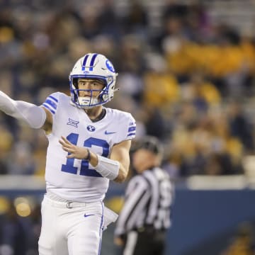 Nov 4, 2023; Morgantown, West Virginia, USA; Brigham Young Cougars quarterback Jake Retzlaff (12) warms up prior to their game against the West Virginia Mountaineers at Mountaineer Field at Milan Puskar Stadium.