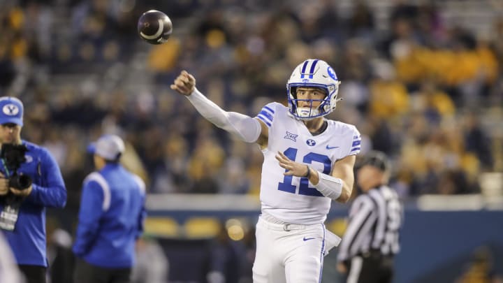 Nov 4, 2023; Morgantown, West Virginia, USA; Brigham Young Cougars quarterback Jake Retzlaff (12) warms up prior to their game against the West Virginia Mountaineers at Mountaineer Field at Milan Puskar Stadium.