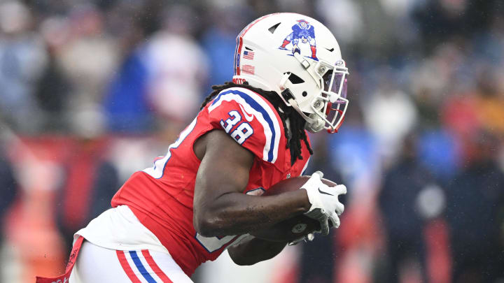 Dec 3, 2023; Foxborough, Massachusetts, USA; New England Patriots running back Rhamondre Stevenson (38) rushes against the Los Angeles Chargers during the first half at Gillette Stadium. Mandatory Credit: Brian Fluharty-USA TODAY Sports